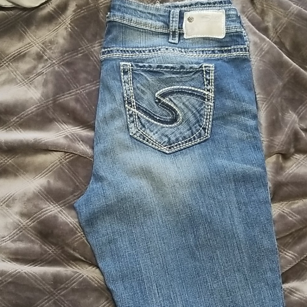 Silver jeans with destressing